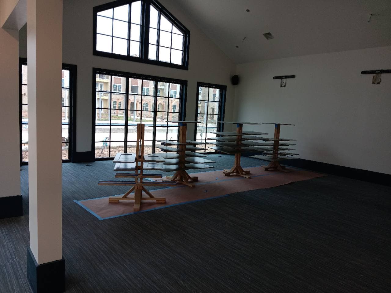 Amenity-space renovation in progress with finishing pieces staged on site.